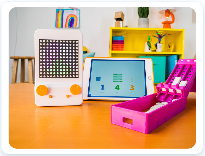 Glow and Cube products on a classroom table