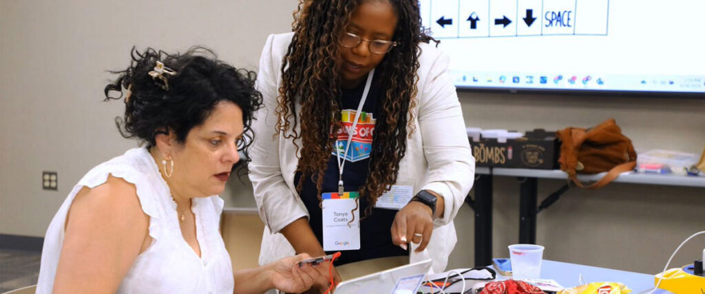 Tonya Coats working with a student on robotics