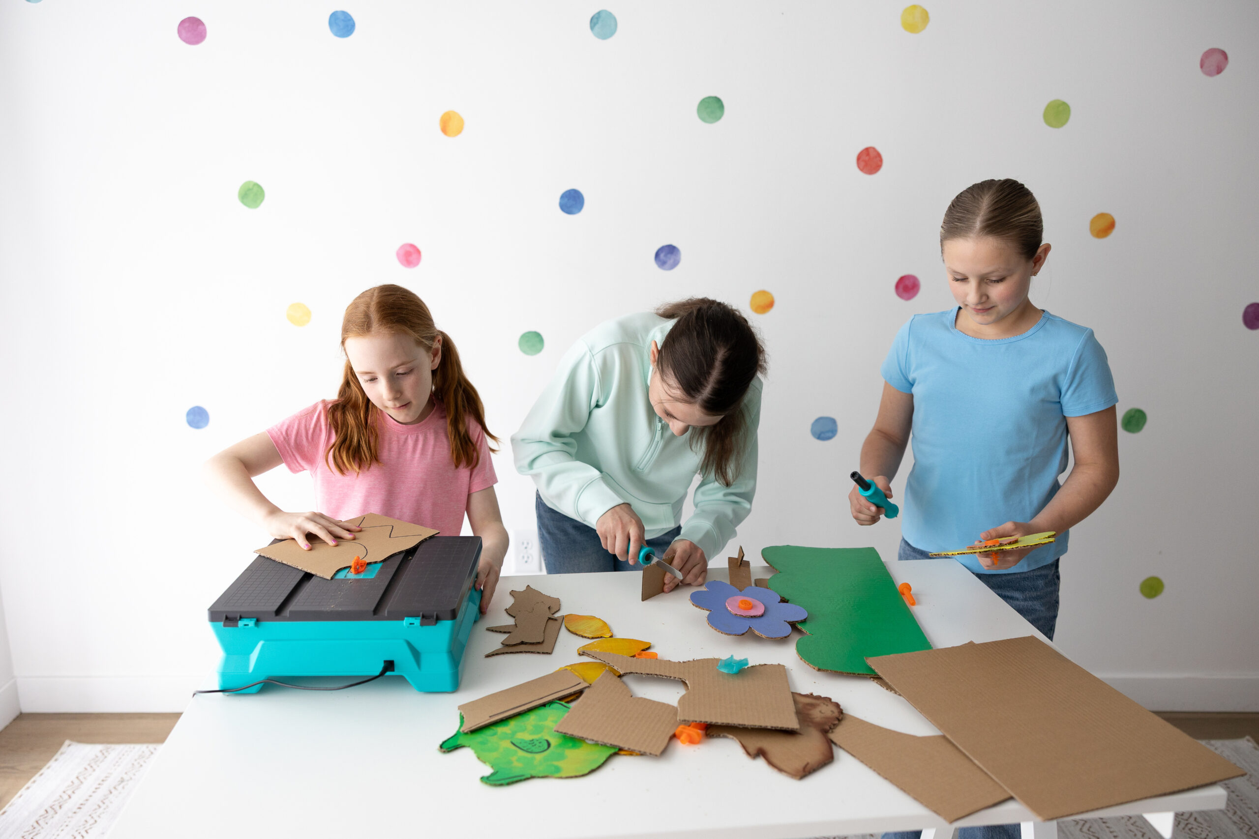 Classroom of students making cardboard builds