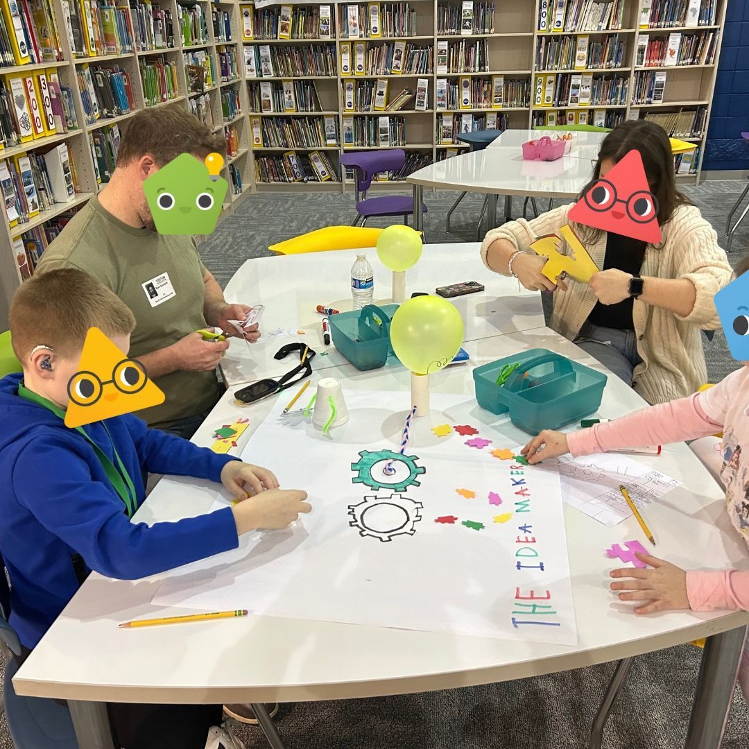 Students using Strawbees with laptops