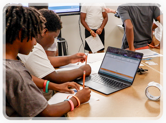 Student working with a laptop and DataSnap project